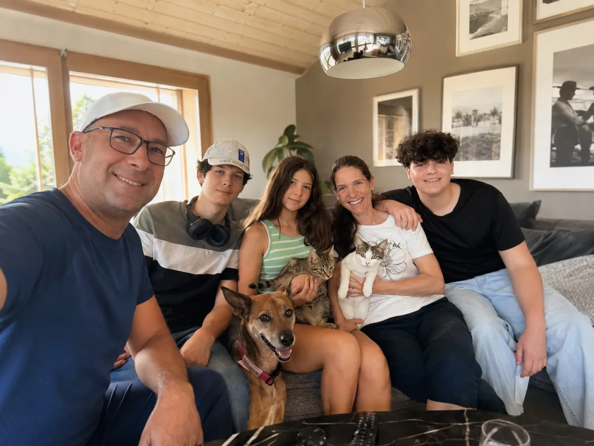 The family behind Owl's Nest, with Whiskey the dog and the cats Cacio e Pepe